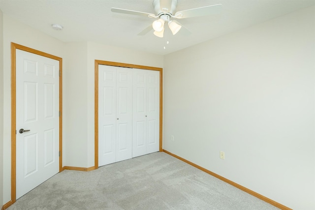 2240 Hart Ave Unit 4, Des Moines, IA 50320 - unfurnished bedroom featuring light colored carpet, a closet, and a ceiling fan