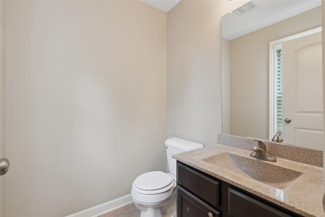16205 Monroe Ct, Urbandale, IA 50323 - half bath featuring vanity and tile patterned flooring