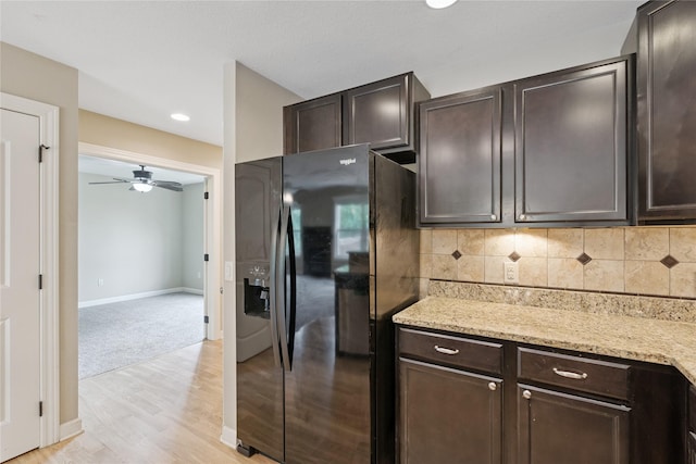 16205 Monroe Ct, Urbandale, IA 50323 - kitchen featuring black refrigerator with ice dispenser, dark brown cabinets, a ceiling fan, light wood-style flooring, and recessed lighting