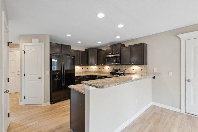 16205 Monroe Ct, Urbandale, IA 50323 - kitchen with appliances with stainless steel finishes, light wood-style flooring, a peninsula, dark brown cabinetry, and recessed lighting