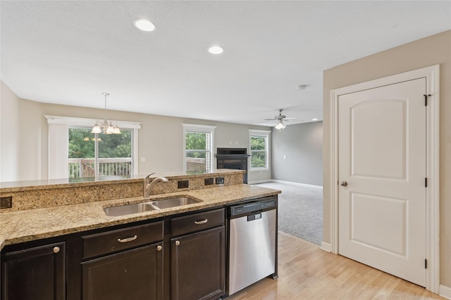 16205 Monroe Ct, Urbandale, IA 50323 - kitchen featuring dishwasher, ceiling fan, decorative light fixtures, dark brown cabinets, and light stone countertops