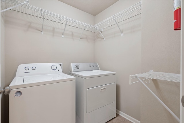 16205 Monroe Ct, Urbandale, IA 50323 - washroom featuring washing machine and dryer and baseboards