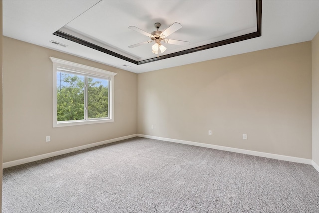 16205 Monroe Ct, Urbandale, IA 50323 - unfurnished room featuring a tray ceiling, ceiling fan, and carpet floors