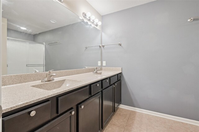 16205 Monroe Ct, Urbandale, IA 50323 - bathroom featuring double vanity and tile patterned flooring