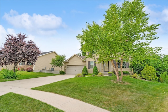 16205 Monroe Ct, Urbandale, IA 50323 - view of property hidden behind natural elements with a front yard, concrete driveway, and a garage