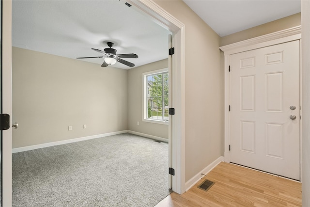 16205 Monroe Ct, Urbandale, IA 50323 - entryway featuring ceiling fan and baseboards