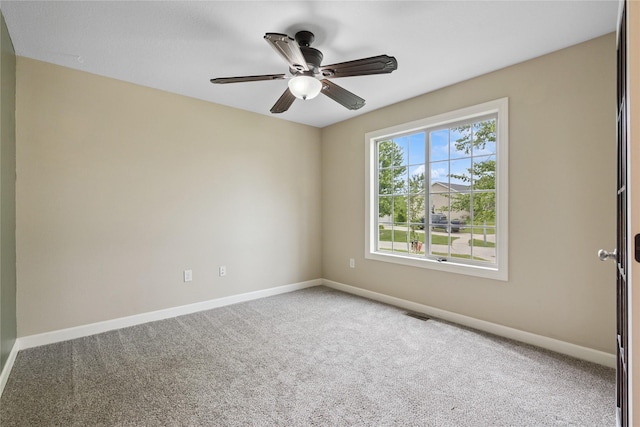16205 Monroe Ct, Urbandale, IA 50323 - spare room featuring carpet flooring and a ceiling fan