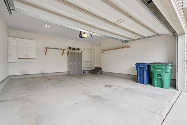 16205 Monroe Ct, Urbandale, IA 50323 - garage featuring a garage door opener