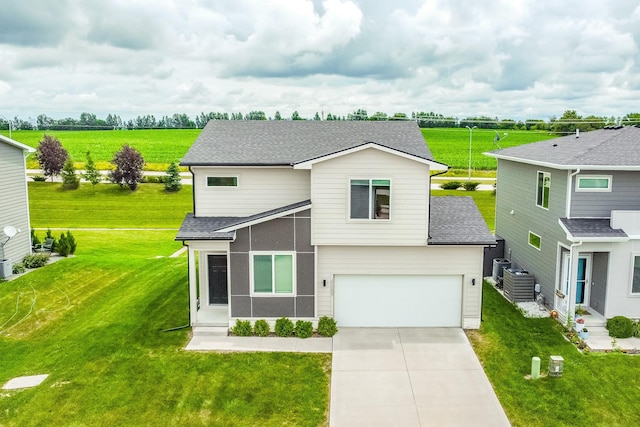 4669 171st St, Urbandale, IA 50323 - view of front of house with an attached garage, roof with shingles, driveway, and a front yard