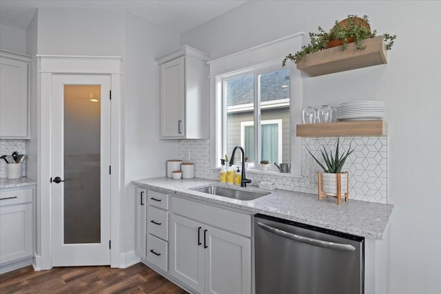 519 Alpha St NW, Bondurant, IA 50035 - kitchen with dishwasher, open shelves, backsplash, dark wood-type flooring, and white cabinets