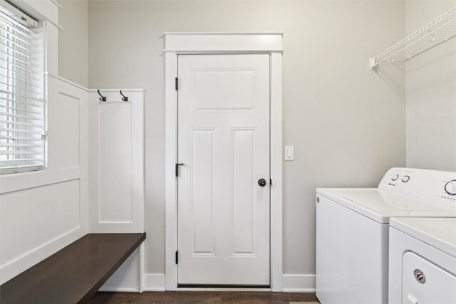 14335 Holcomb Ave, Urbandale, IA 50323 - laundry area with separate washer and dryer, healthy amount of natural light, and dark wood-style flooring