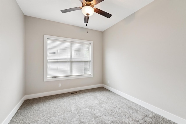 14335 Holcomb Ave, Urbandale, IA 50323 - spare room featuring carpet flooring and a ceiling fan