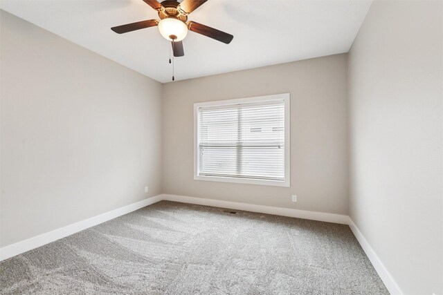 14335 Holcomb Ave, Urbandale, IA 50323 - carpeted empty room with baseboards and a ceiling fan