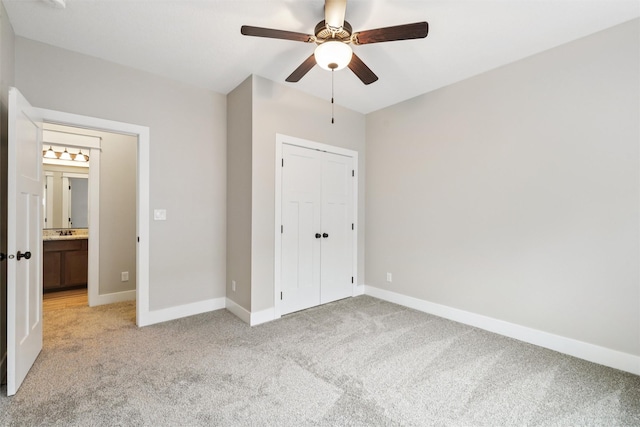 14335 Holcomb Ave, Urbandale, IA 50323 - unfurnished bedroom featuring light carpet, a closet, and ceiling fan