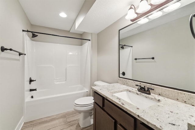 14335 Holcomb Ave, Urbandale, IA 50323 - full bathroom with vanity, tub / shower combination, wood finished floors, and recessed lighting