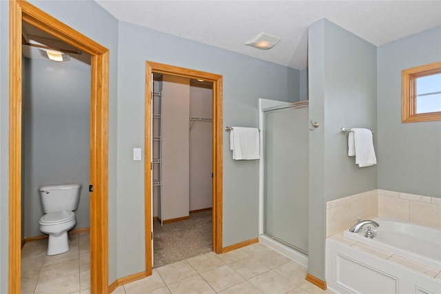 1201 NW Norton St, Grimes, IA 50111 - full bathroom with a stall shower, a garden tub, a spacious closet, and tile patterned flooring