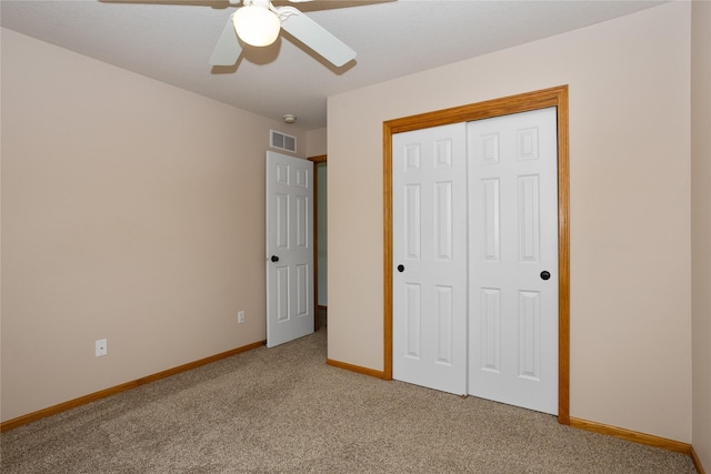 1201 NW Norton St, Grimes, IA 50111 - unfurnished bedroom featuring light colored carpet, a closet, and ceiling fan