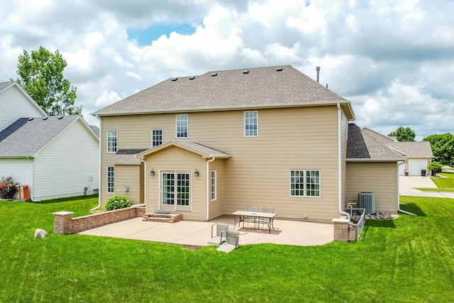 1201 NW Norton St, Grimes, IA 50111 - rear view of house with a yard, a patio, and a shingled roof