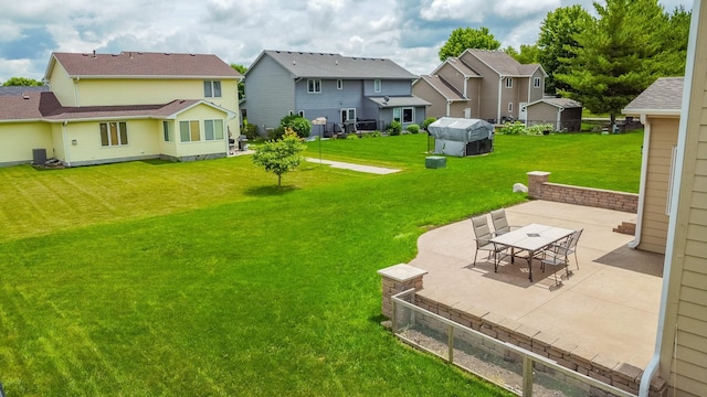 1201 NW Norton St, Grimes, IA 50111 - view of grassy yard featuring a patio area and a residential view