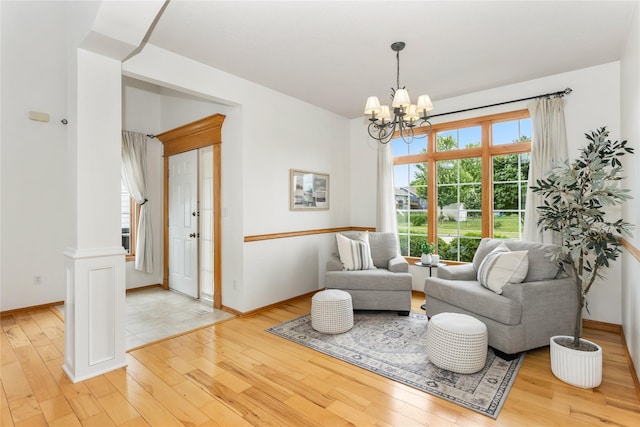 1201 NW Norton St, Grimes, IA 50111 - sitting room featuring hardwood / wood-style floors and a chandelier