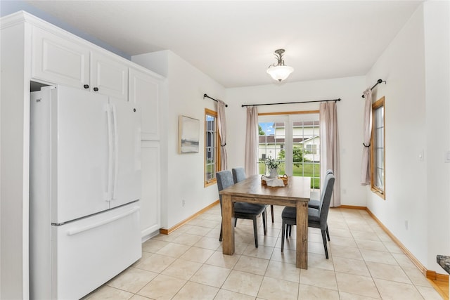 1201 NW Norton St, Grimes, IA 50111 - dining space featuring baseboards and light tile patterned floors