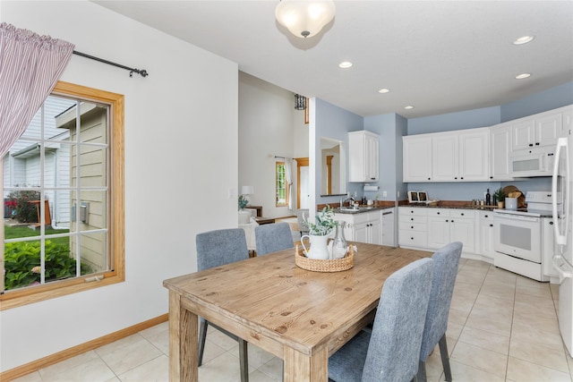 1201 NW Norton St, Grimes, IA 50111 - dining room featuring light tile patterned floors and recessed lighting