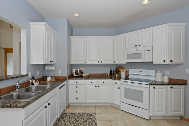 1201 NW Norton St, Grimes, IA 50111 - kitchen featuring white appliances, white cabinetry, light tile patterned flooring, and recessed lighting