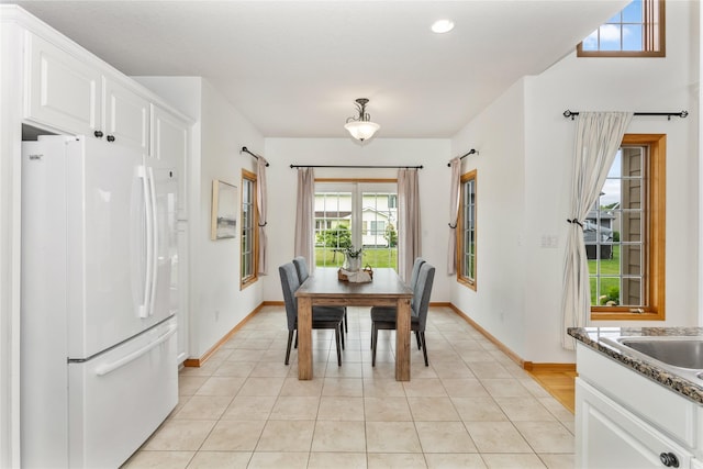 1201 NW Norton St, Grimes, IA 50111 - dining space featuring plenty of natural light, light tile patterned floors, and recessed lighting