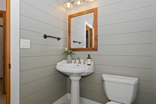 1201 NW Norton St, Grimes, IA 50111 - bathroom featuring wooden walls