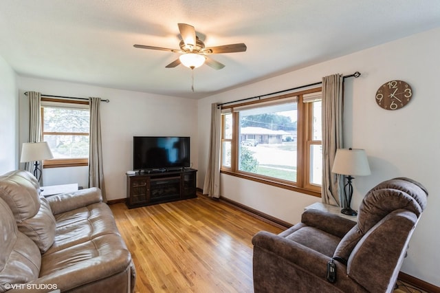 3709 Aurora Ave, Des Moines, IA 50310 - living room featuring ceiling fan and light wood-style floors