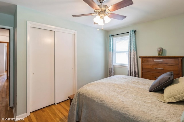 3709 Aurora Ave, Des Moines, IA 50310 - bedroom with a closet, light wood-style floors, and a ceiling fan