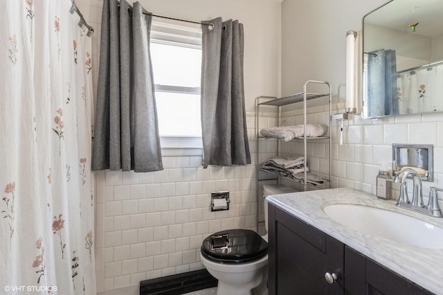 3709 Aurora Ave, Des Moines, IA 50310 - bathroom with vanity, tile walls, and a shower with curtain