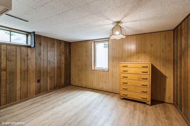 3709 Aurora Ave, Des Moines, IA 50310 - basement featuring wood finished floors and wooden walls