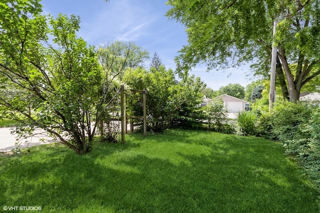 3709 Aurora Ave, Des Moines, IA 50310 - view of green lawn with a garage