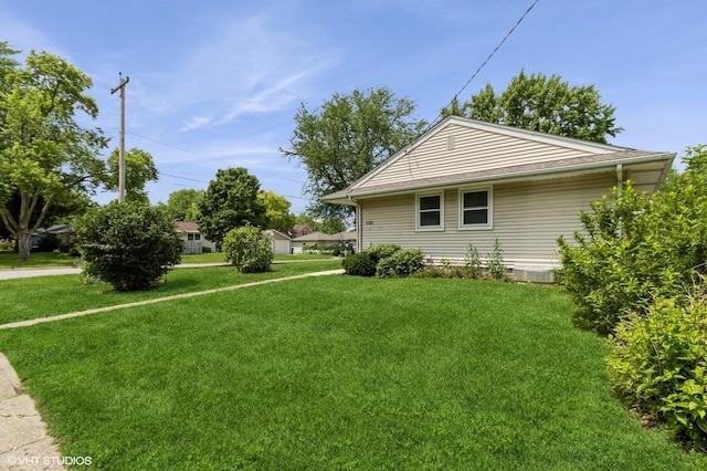 3709 Aurora Ave, Des Moines, IA 50310 - view of side of home featuring a yard