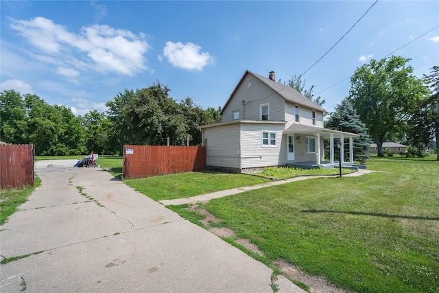 6325 NW 56th St, Johnston, IA 50131 - view of home's exterior featuring covered porch, driveway, and a chimney