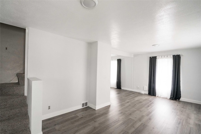 6325 NW 56th St, Johnston, IA 50131 - unfurnished room with wood finished floors and baseboards