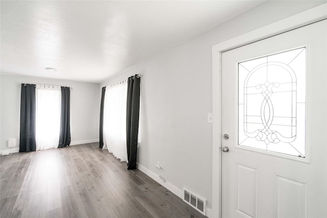 6325 NW 56th St, Johnston, IA 50131 - foyer entrance featuring wood finished floors and baseboards