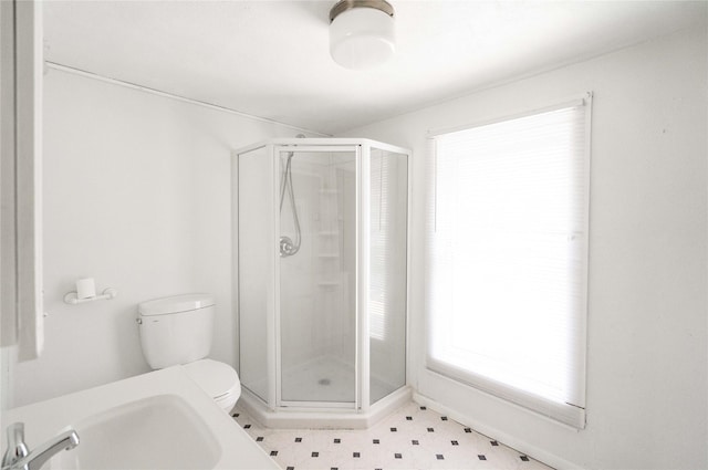 6325 NW 56th St, Johnston, IA 50131 - bathroom featuring toilet and a shower stall