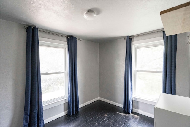 6325 NW 56th St, Johnston, IA 50131 - unfurnished room with dark wood-style floors and healthy amount of natural light