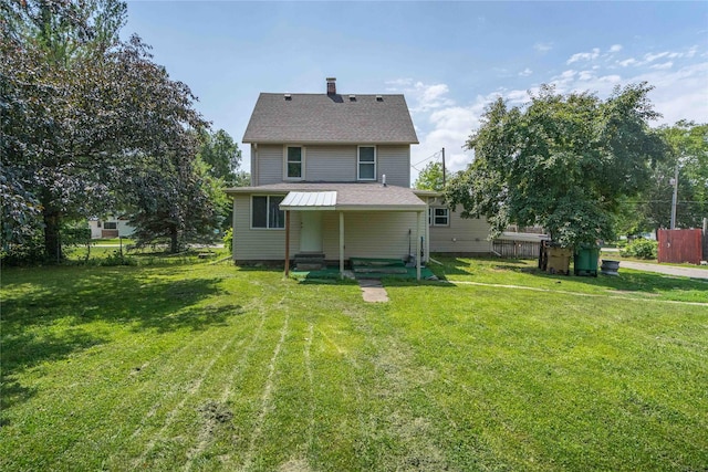 6325 NW 56th St, Johnston, IA 50131 - rear view of house featuring entry steps, a chimney, and a shingled roof