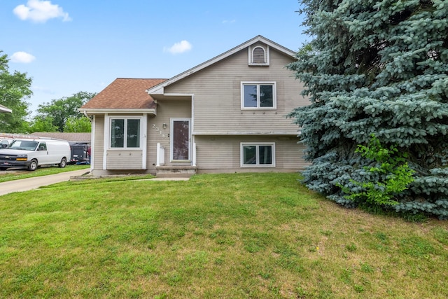 2316 SE 17th St, Des Moines, IA 50320 - tri-level home with a front yard and roof with shingles