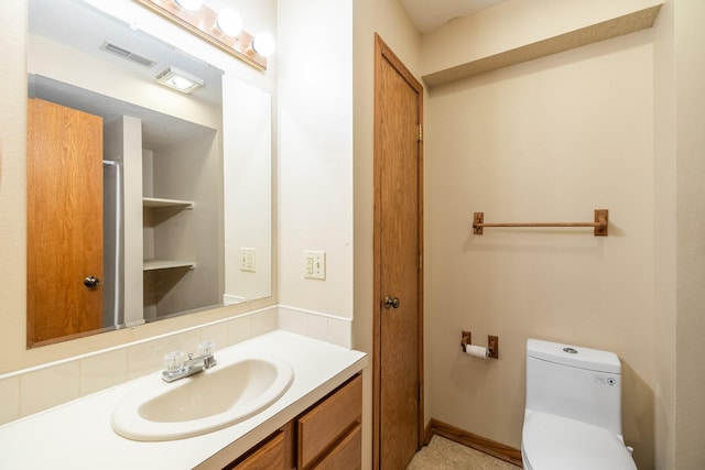 2316 SE 17th St, Des Moines, IA 50320 - bathroom featuring vanity and tasteful backsplash