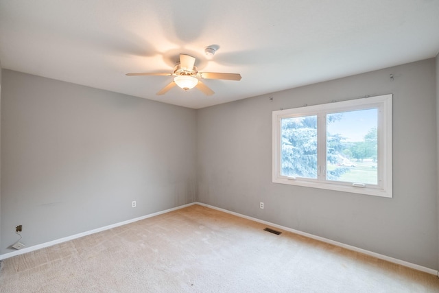 2316 SE 17th St, Des Moines, IA 50320 - empty room featuring ceiling fan and light carpet