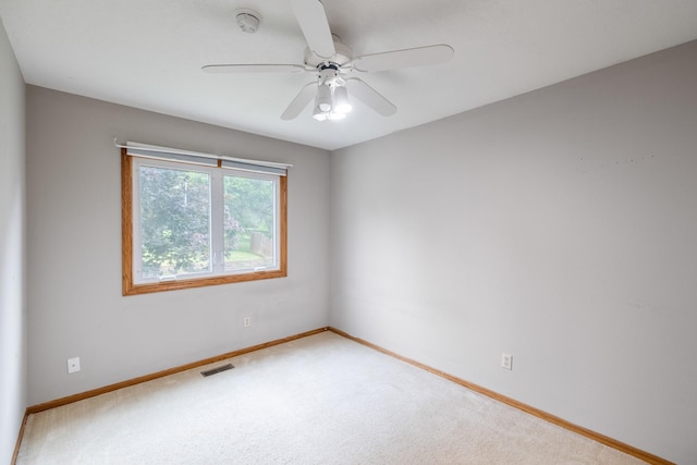 2316 SE 17th St, Des Moines, IA 50320 - carpeted spare room with a smoke detector and a ceiling fan