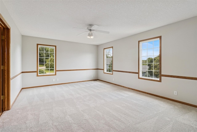 8001 Sheridan Dr, Urbandale, IA 50322 - unfurnished room featuring carpet floors, ceiling fan, and a textured ceiling