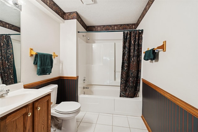 8001 Sheridan Dr, Urbandale, IA 50322 - full bathroom featuring a wainscoted wall, vanity, shower / tub combo, a textured ceiling, and tile patterned floors