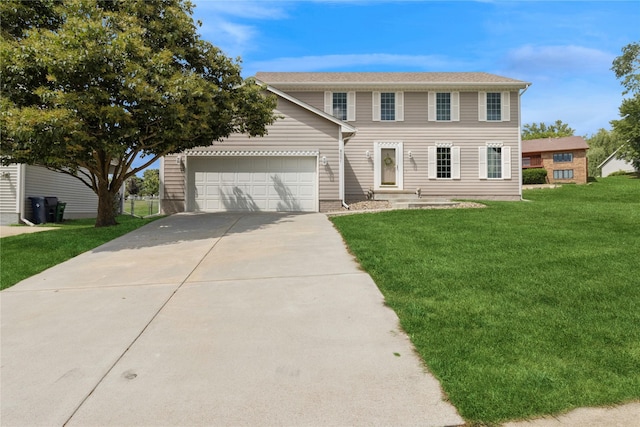8001 Sheridan Dr, Urbandale, IA 50322 - colonial house with a front yard, an attached garage, and driveway