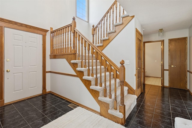 8001 Sheridan Dr, Urbandale, IA 50322 - entrance foyer with stairs