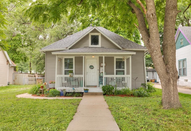 420 9th St, West Des Moines, IA 50265 - bungalow featuring roof with shingles and covered porch